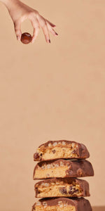 vertical banner with hand holding a protein ball and at the bottom protein bars