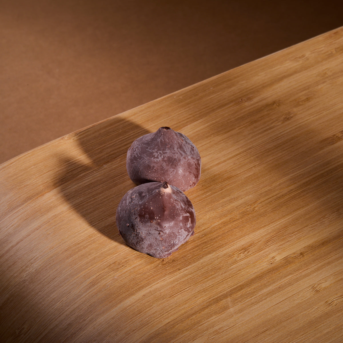 Cocoa Coated Protein Balls Cinnamon Cream on a wooden board