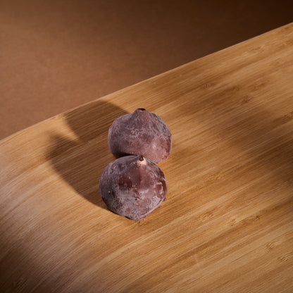 Cocoa Coated Protein Balls Cinnamon Cream on a wooden board