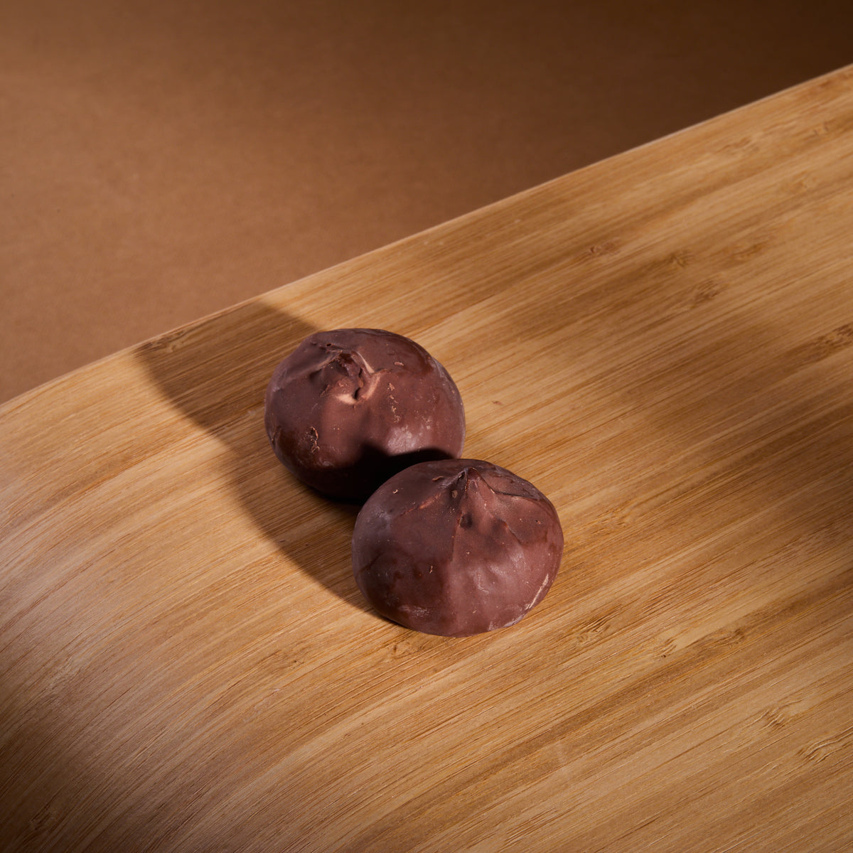 Cocoa Coated Protein Balls Cocoa Cream on a wooden board