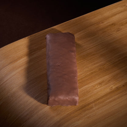 Protein Bar Deluxe Chocolate on a wooden board