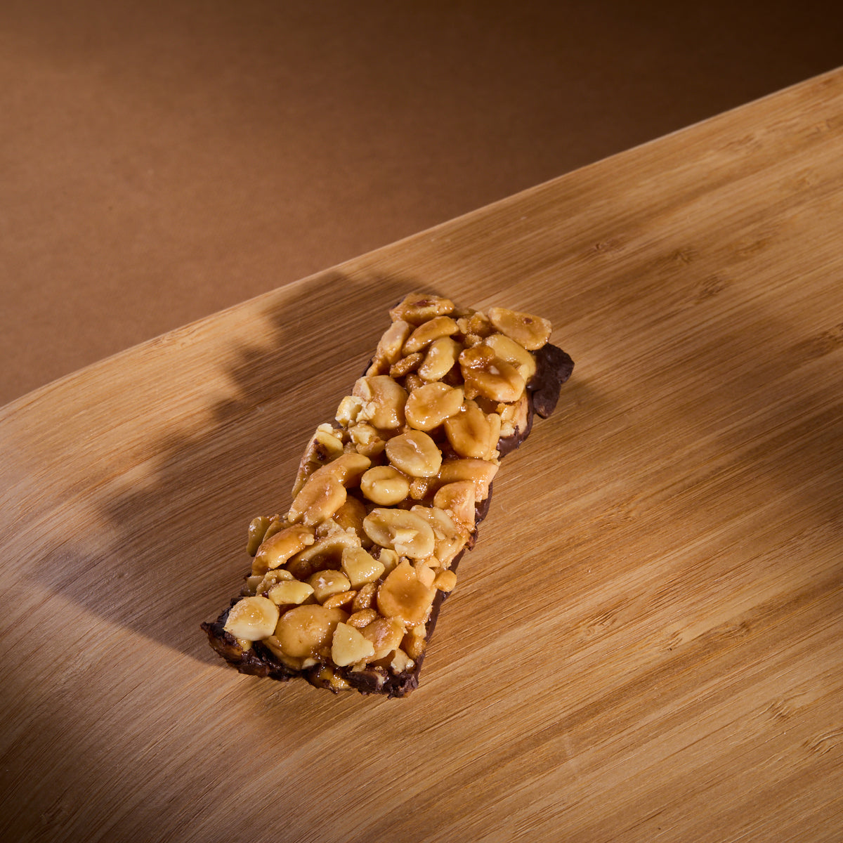 Protein Nuts Caramel Salt Peanuts on a wooden board