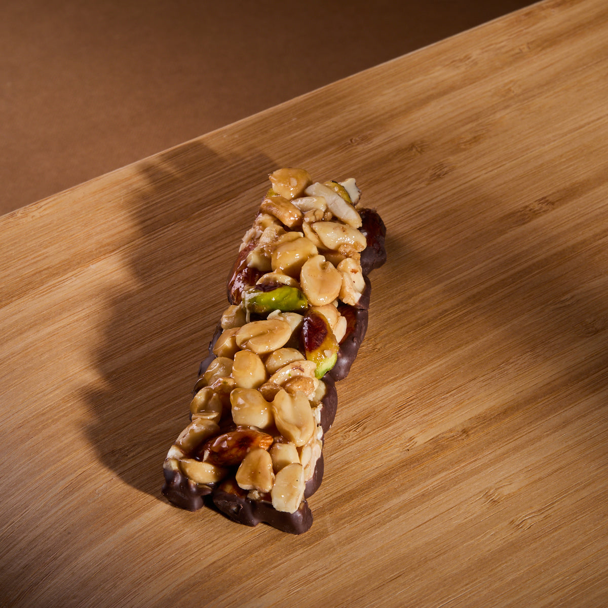 Protein Nuts Pure Mix Cocoa on a wooden board