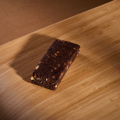 Raw Bar Crunchy Almond and Chocolate on a wooden board
