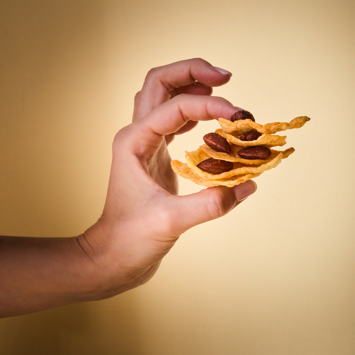 A hand holding Salty Fusion BBQ Addicted