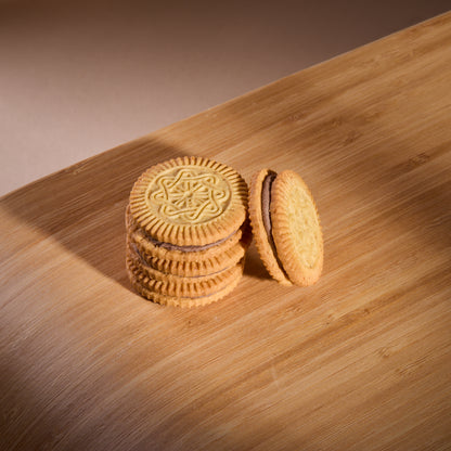 Vanilla Cookies with Cocoa Filling on a wooden board