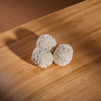 Vegan Wafer Balls Almonds and Coconut on a wooden board